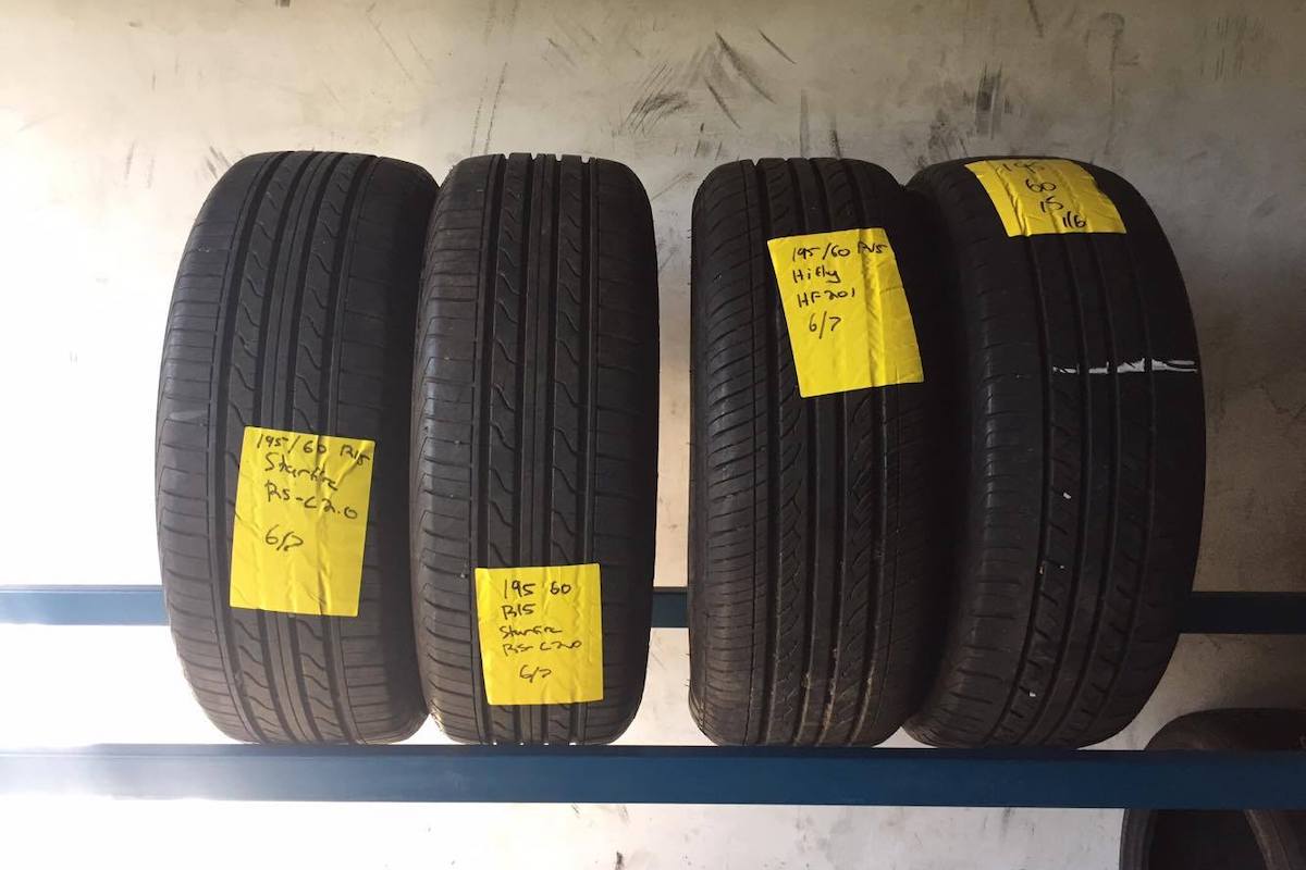 4 tyres on a rack ready for purchase