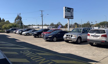 a selection of cars parked in an australian car park