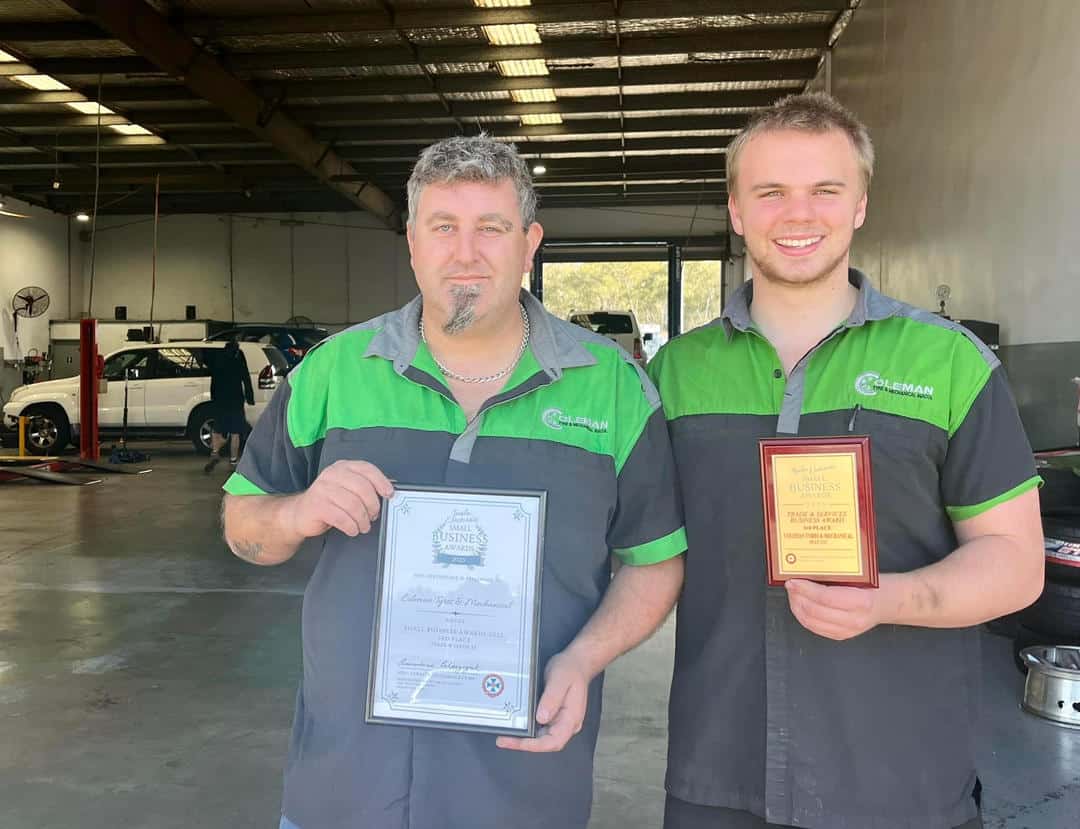Coleman Tyres & Mechanical employees Josh & Brendan hold certificates for prizes won in the Small Business Awards