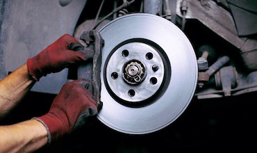 A mechanic keeping brakes pads in perfect condition