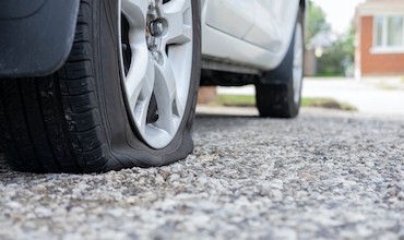 A close up of a punctured tyre in need of repair