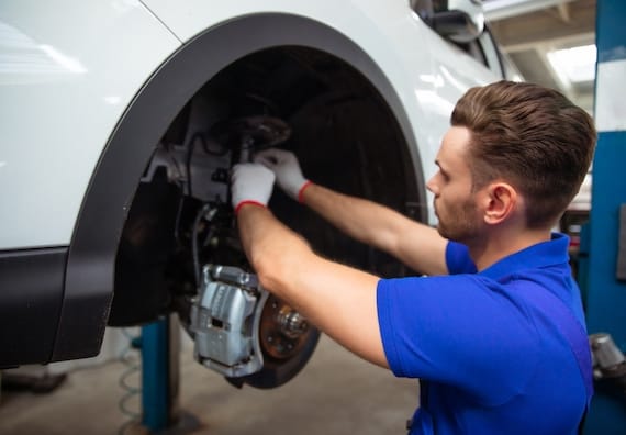 A mechanic making brakes and mechanical improvements